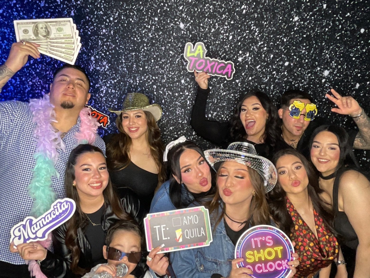 Guests enjoying a modern interactive photo booth rental at a Texas event